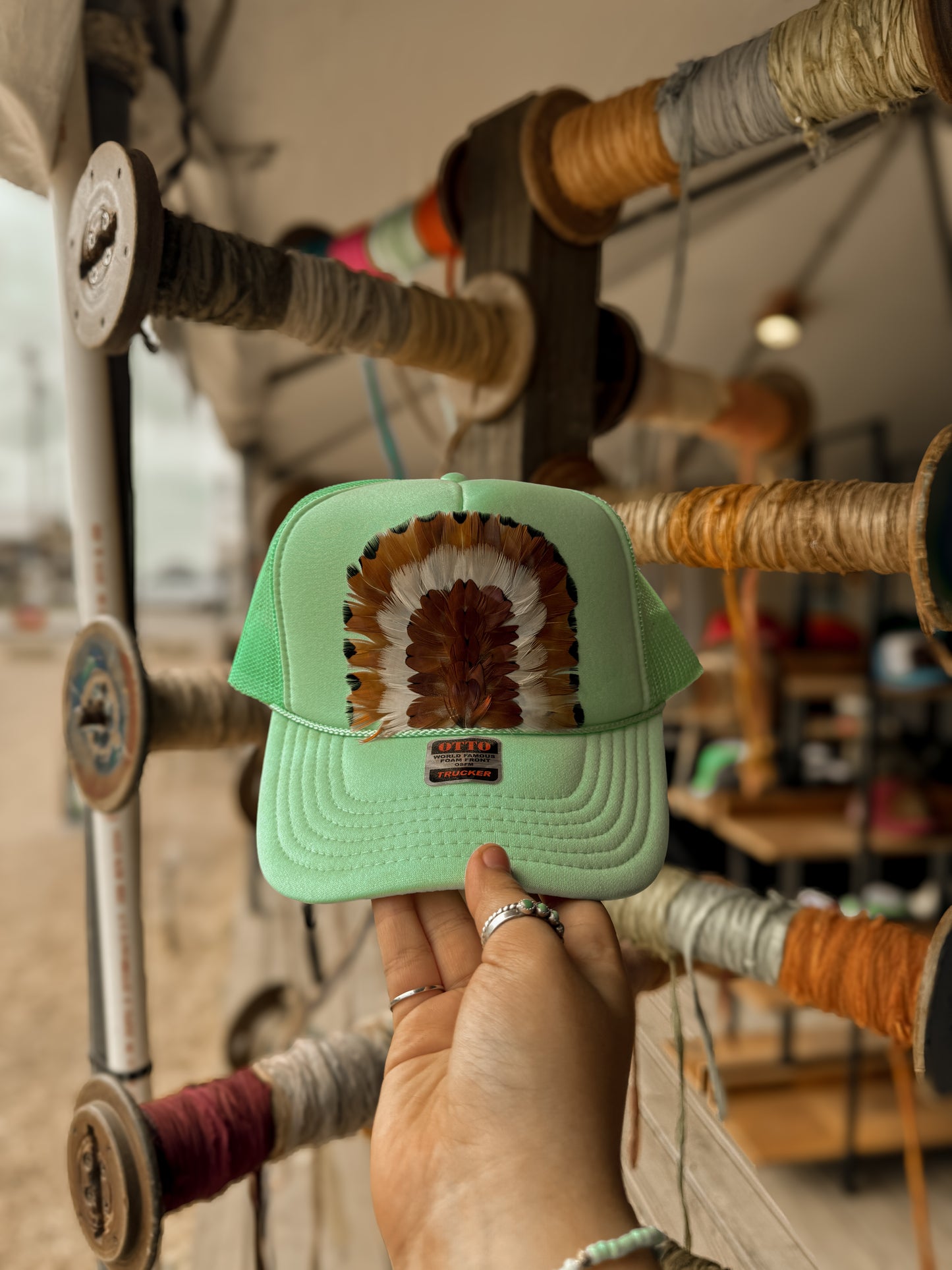 Feathered trucker hat