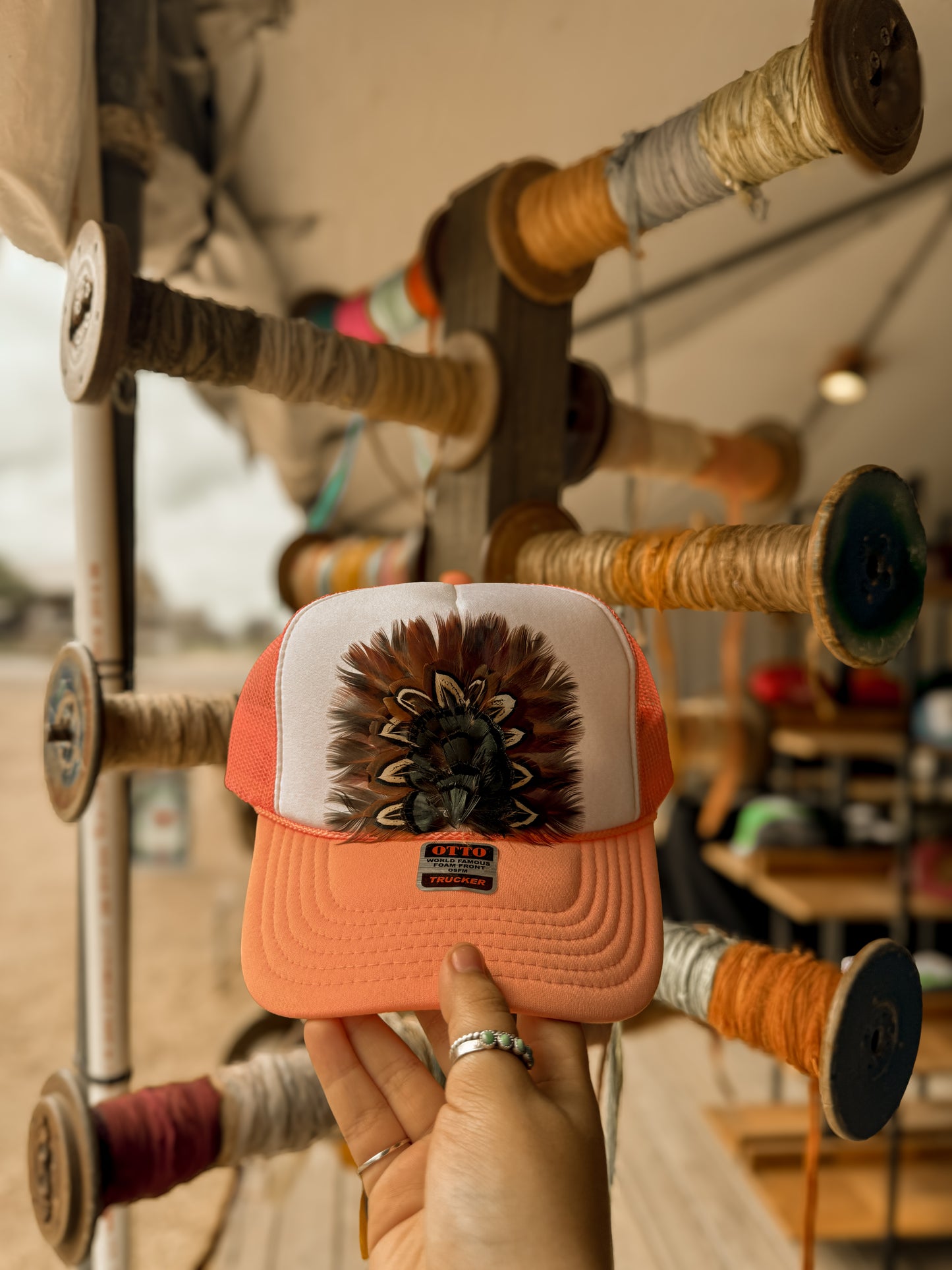 Feathered trucker hat